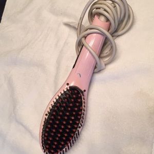 Hair straightener and comb in one